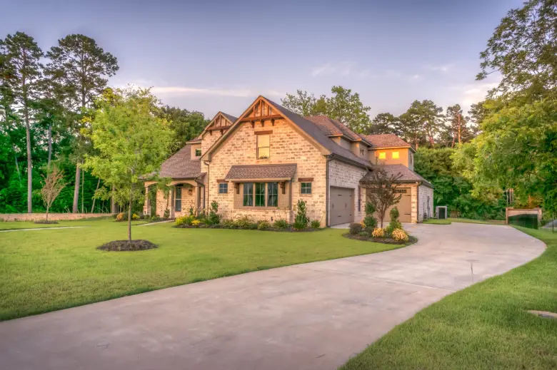 Beautiful custom home with well-maintained gutters and roofing in San Antonio, Texas